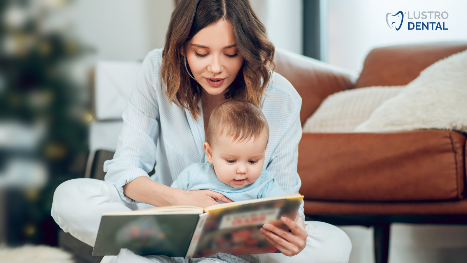 A parent reads a dental-themed book with their baby after the visit to reinforce positive associations.